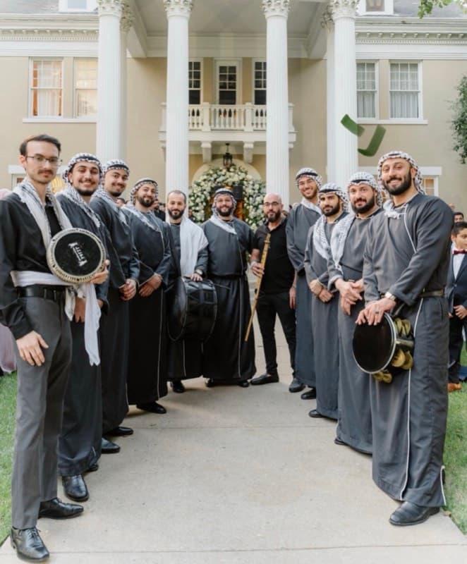 Yusuf performing at a Middle Eastern wedding with his band
