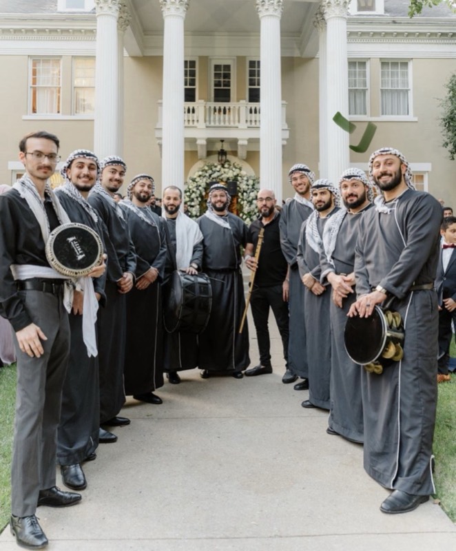 Yusuf performing at a Middle Eastern wedding with his band